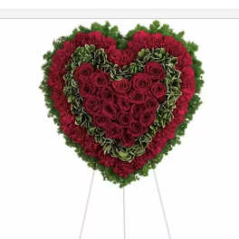 Heart-shaped floral standing spray with red roses and carnations