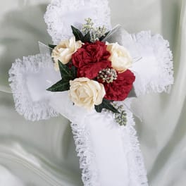 White lace cross with red and cream roses