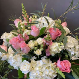 Pink and white rose bouquet with hydrangeas and greenery