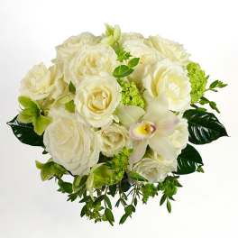 White rose bouquet with a pale orchid and green accents