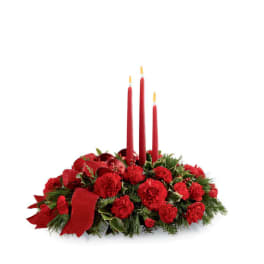 Red carnation centerpiece with three red taper candles