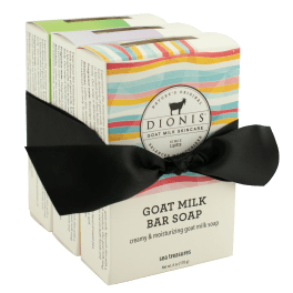 Three boxed bars of goat milk soap tied with a black ribbon