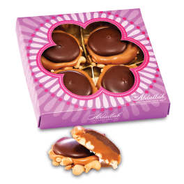 Box of chocolate-covered treats with one piece shown outside the package