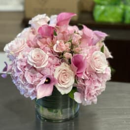 Pink and white bouquet in a glass vase