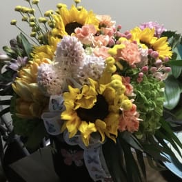 Bouquet with sunflowers, pastel carnations, and hyacinths