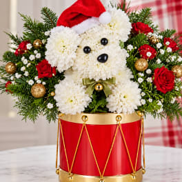 Christmas teddy bear floral arrangement in a red drum container