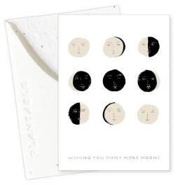Greeting card with moon faces and the text 'Wishing You Many More Moons'