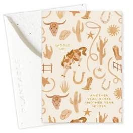 Western-themed birthday card with cowboy motifs and gold text