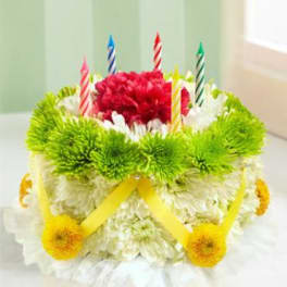 Birthday cake made of flowers with striped candles