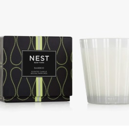 Scented candle in a glass tumbler with its box