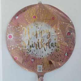 Round pink foil balloon with "Happy Birthday" text