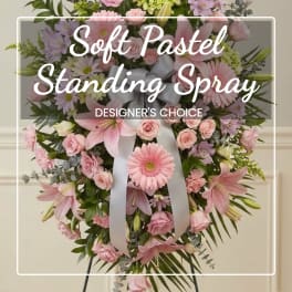 Pink and white standing spray with a ribbon bow