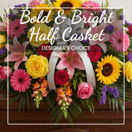 Colorful half-casket floral spray with roses, lilies, and sunflowers