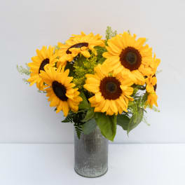Sunflower bouquet in a ribbed metal vase