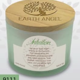 A green candle jar with a wooden lid labeled Earth Angel