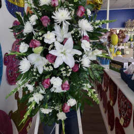 Large standing spray of white lilies, pink roses, and white chrysanthemums