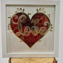 Framed heart artwork with the word Love in the center