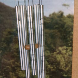 Silver wind chime hanging outdoors