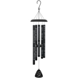 Black hanging wind chime with patterned tubes and a heart-shaped clapper