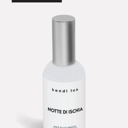 Bottle of scented room spray with a silver cap