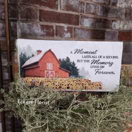 Sympathy card with a barn and sunflower field on a brick wall