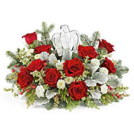 Red roses with white accents and an angel ornament