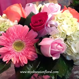 Pink and white bouquet with roses, gerbera daisy, and hydrangeas