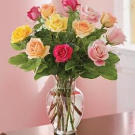 Mixed roses in a clear glass vase