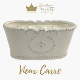 Cream ceramic candle vessel with ornate embossed detailing