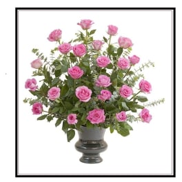 Pink roses arranged in a dark urn vase