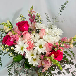 Bouquet of pink roses and white daisies with eucalyptus