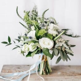White and green bouquet with ribbon tied stems