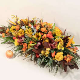 Autumn floral centerpiece with orange and yellow blooms