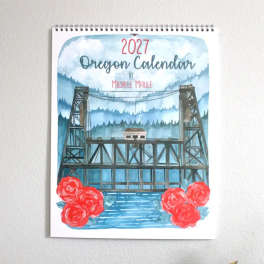 Spiral-bound 2027 Oregon calendar with red roses at the bottom