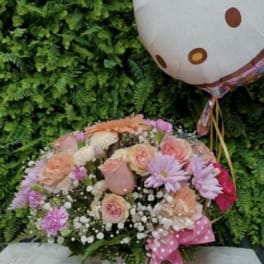 Mixed pink and peach bouquet with a Hello Kitty balloon