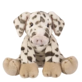 Plush spotted dog toy sitting on a white background