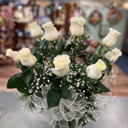 Bouquet of white roses with baby's breath and a sheer ribbon