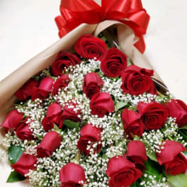 Bouquet of red roses with baby's breath and a large red bow