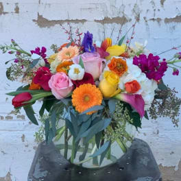 Colorful mixed bouquet in a clear glass vase