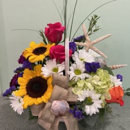 Bouquet with sunflowers, roses, daisies, and a starfish accent