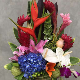 Tropical bouquet with red heliconia, blue hydrangea, and white anthuriums