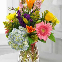 Colorful mixed bouquet in a clear glass vase