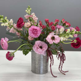 Pink and red mixed bouquet in a silver vase