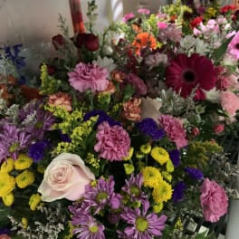 Mixed bouquet with pink, purple, yellow, and white flowers