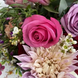 Pink rose and pale dahlia bouquet with small white blossoms