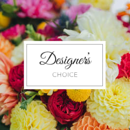 Mixed bouquet of colorful flowers with a "Designer's Choice" card
