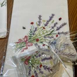 Embroidered floral napkins with lavender and pink ribbon bows