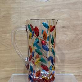 Clear glass pitcher with colorful leaf pattern