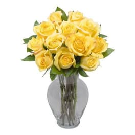 Bouquet of yellow roses in a clear glass vase
