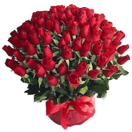 Bouquet of red roses wrapped with a red ribbon